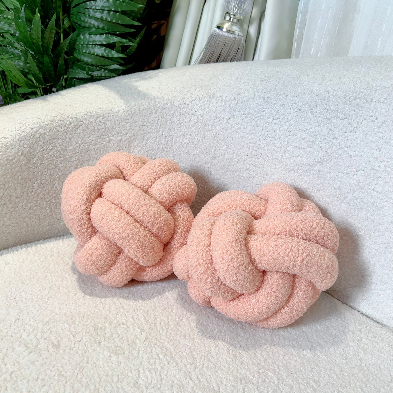 PEACH KNOT THROW PILLOW (8” IN DIAMETER)