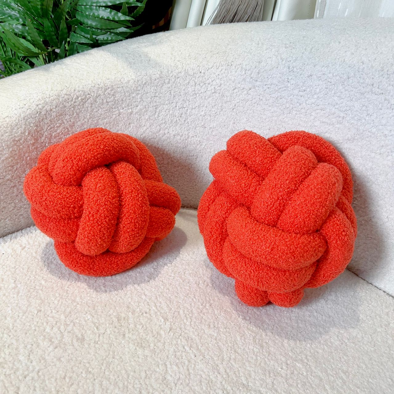 ORANGE KNOT THROW PILLOW (8” IN DIAMETER)