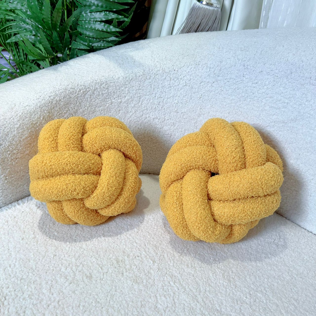 YELLOW KNOT THROW PILLOW (8” IN DIAMETER)